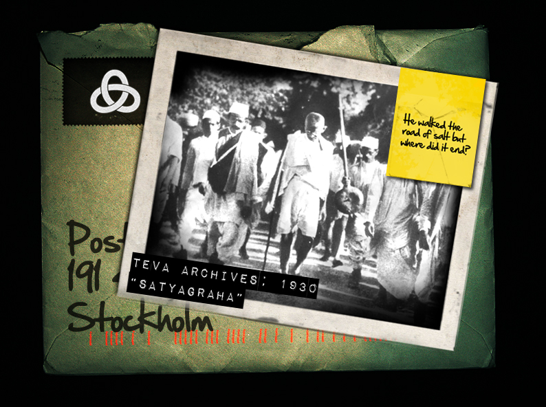 An aged archival envelope: a Salt March photograph, a handwritten note, morse code and the Tea4Two seal